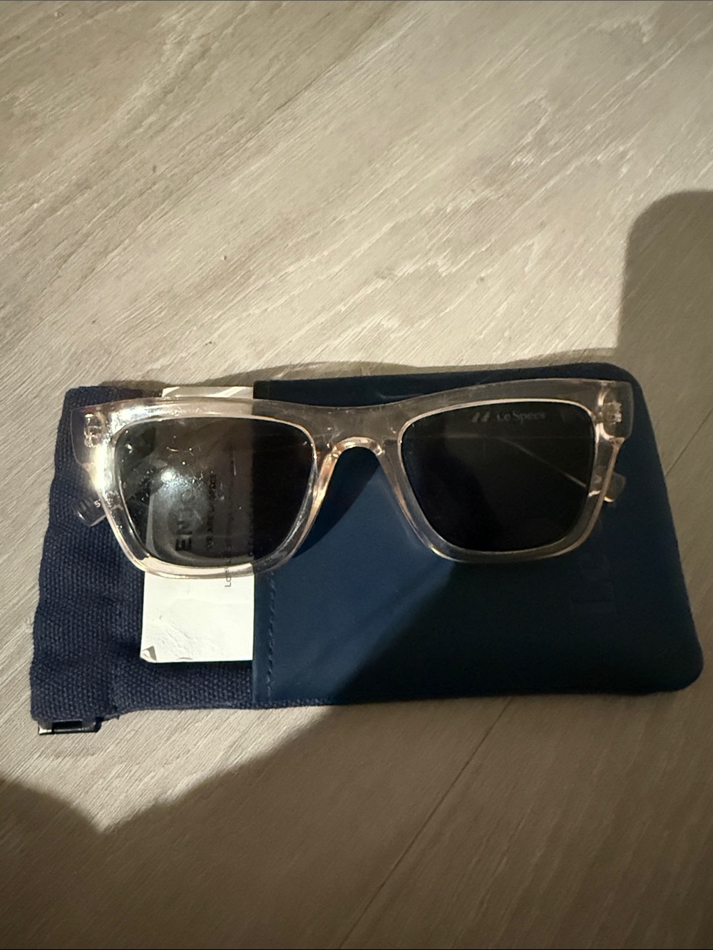Le Specs Clear Frame Sunglasses with Black Lenses